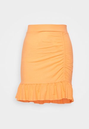 Jupe orange, ajustée, avec un ourlet volanté et des détails de fronces sur les côtés. Fabriquée à partir d'un tissu lisse et extensible.
