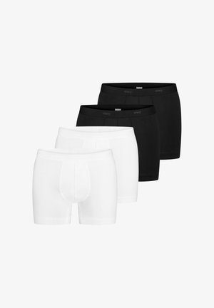 Fire par mænds boxer shorts i sort og hvid, arrangeret diagonalt med to sorte par bagtil og to hvide par foran.