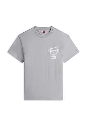 Light gray short-sleeve cotton T-shirt with "Tommy" script and city names printed in white on chest, small Tommy Hilfiger flag on left sleeve.