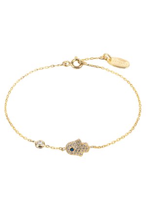 Gold chain bracelet features a fish charm adorned with blue and clear gemstones, showcasing a delicate design and subtle texture.
