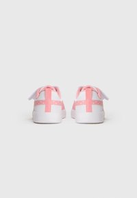 White sneakers with pink accents and floral patterns on the sides, shown from the back on a plain white background.