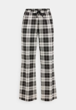 Czarno-białe spodnie w kratę o luźnym kroju, z elastyczną talią i detalem w postaci sznurka. Miękka tkanina z wzorem w kratę na całej powierzchni.
