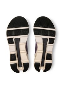 Shoe soles with black rubber traction patterns, white midsole with segments, and a central black Speedboard feature.