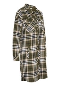 Robe-chemise à carreaux verts en tissu doux, avec fermeture à boutons, deux poches poitrine et poches latérales. Manches longues avec poignets.