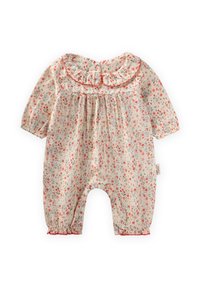 Cvečni romper v kremni barvi z rdečimi in zelenimi vzorci, ki ima nabran ovratnik, zapiranja na gumbčke in zbrano elastično manšeto na odprtinah za noge.