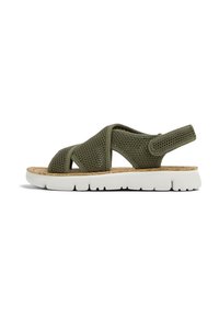 Green mesh sandal with crossover straps, cork insole, and white rubber sole featuring grooves for traction. Adjustable back strap.