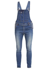 Salopette en denim bleu avec bretelles réglables, poche poitrine avant avec rabat à bouton, boutons latéraux et jambes ajustées.