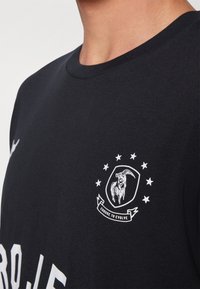 Under Armour Triko s potiskem - black/white