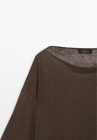 Brown knitted sweater with wide neckline and long sleeves, hanging against a white background.
