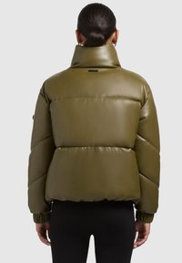 Olive green puffer jacket with a high collar, glossy finish, and elastic cuffs. Features horizontal quilted sections and a brand label on the back.