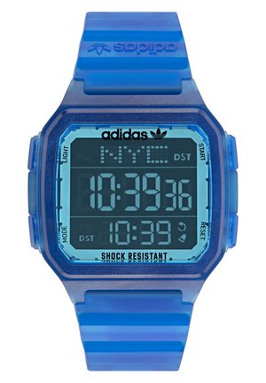 Orologio digitale con un cinturino in silicone blu e una cassa esagonale blu. Le caratteristiche includono un display digitale che mostra ora, data e resistenza agli urti.