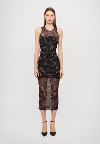 Black sheer dress featuring floral patterns in pink, form-fitting design, midi length, and a ruched texture on the bodice. Adjusted shoulder straps.