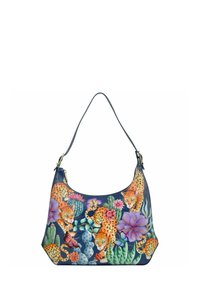 Hobo tas in donkerblauw leer met een all-over print van leopard, cactussen en bloemen. Enkele schouderband en accenten in goudkleurig metaal.