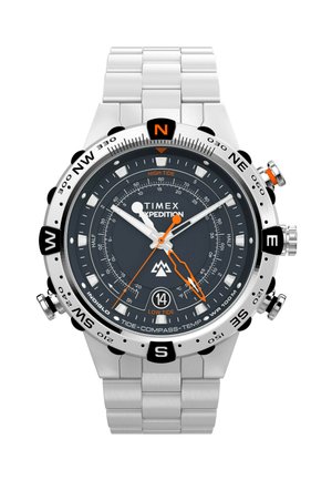 Timex Expedition watch with a dark gray dial, stainless steel band, orange accents, and a bezel marked with cardinal directions and tide indicators.