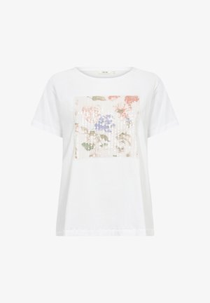 White cotton t-shirt featuring a square, sequined floral design in soft pink, blue, and green tones on the front. Short sleeves, crew neck.