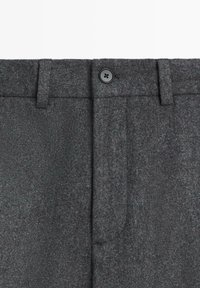 Gray wool blend trousers with a textured finish, featuring a buttoned waistband and two side pockets.