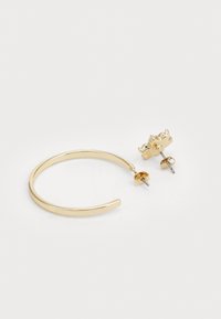 Gold hoop earrings with a textured crown accent. Features include a smooth, shiny surface and a secure post-back closure.