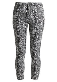 Leggings con estampado de serpiente en blanco y negro, que presentan un diseño ajustado y una textura suave. Sin hardware o acentos visibles.