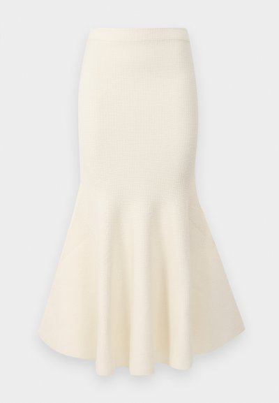 Tejelt ceruza szoknya krém színben, lágyan bővülő szegéllyel. Texturált felület és testhez álló fazon jellemzi, amelyet szabott megjelenés érdekében terveztek.