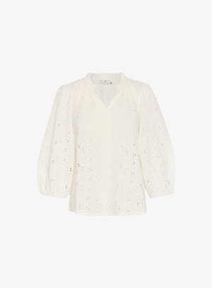 Valge särk v-dekoltee, kogutud kaeluse ja puhvärvidega. Omab pitsikanga tikandeid lillemusteritega ning kerget tekstuuri.