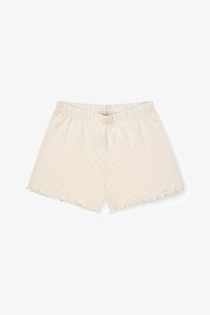 Shorts tricotés de couleur crème avec une taille élastique et un ourlet festonné, présentant un motif texturé subtil sur toute la surface.