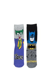 Calze di cotone con design colorati; la calza sinistra mostra Il Joker in grigio e viola, mentre la calza destra presenta Batman in nero e grigio.