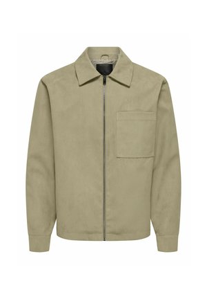 Veste beige zippée avec col, poche plaquée côté gauche de la poitrine, manches longues et ourlet droit, présentée sur fond blanc.
