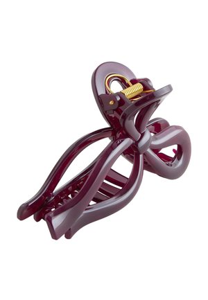 Glossy dark purple hair clip with a gold metal spring, curved claw design for holding hair securely.