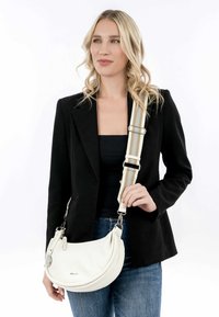 White leather shoulder bag with a curved design and two-tone striped adjustable strap. Silver hardware accents enhance functionality.