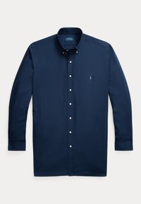 Chemise bleu marine à manches longues avec fermeture par boutons, col boutonné et petit logo brodé sur la poitrine gauche.