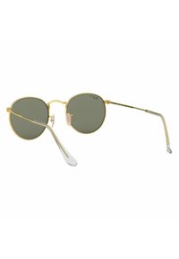 Occhiali da sole rotondi con montatura in metallo dorato, lenti verdi e punte in acetato trasparente. Naselli notevoli per il comfort e un design elegante.