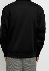 River Island Stickad tröja - black