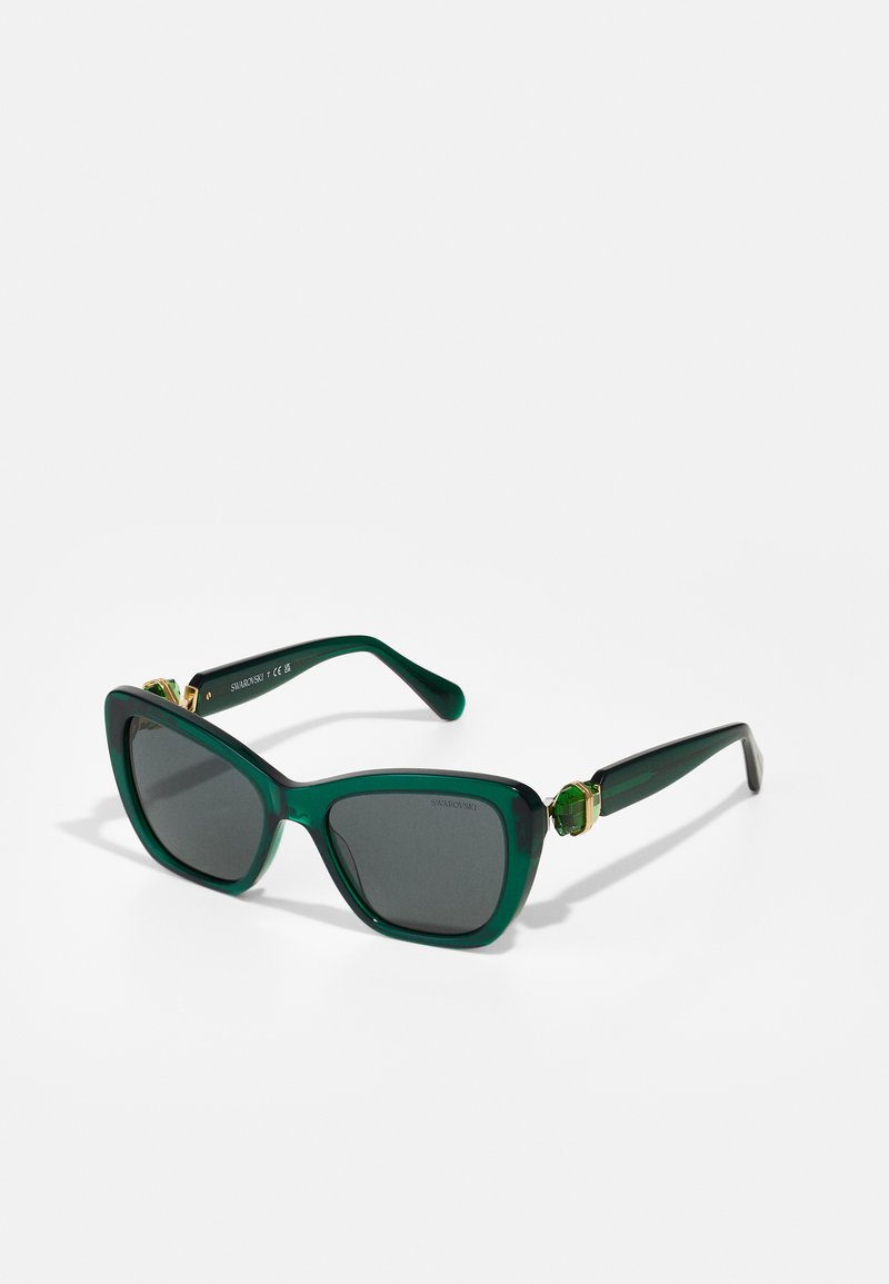 Ochelari de soare verzi de mari dimensiuni cu lentile întunecate, formă rectangulară, finisaj lucios, accente de metal aurit și elemente decorative pe brate.