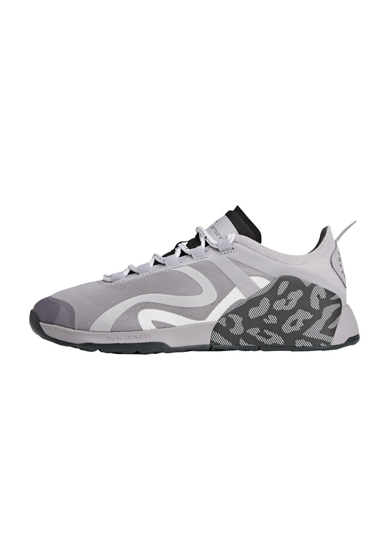 Gray athletic shoe with mesh upper, sleek design, black accents, rubber sole, and unique textured pattern on heel. Laces in contrasting color.
