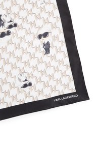 Seidenschal mit einem hellbeigen und weißen Muster und schwarzen Akzenten. Das Design umfasst Cartoonfiguren und das Logo "Karl Lagerfeld".