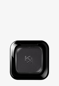 Fard à paupières noir compact avec logo "KJ" en relief, dans un boîtier carré noir brillant, sur fond gris clair.