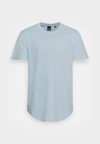 Light blue short-sleeve t-shirt made from soft fabric, featuring a crew neck and a rounded hem at the bottom. No visible patterns or accents.