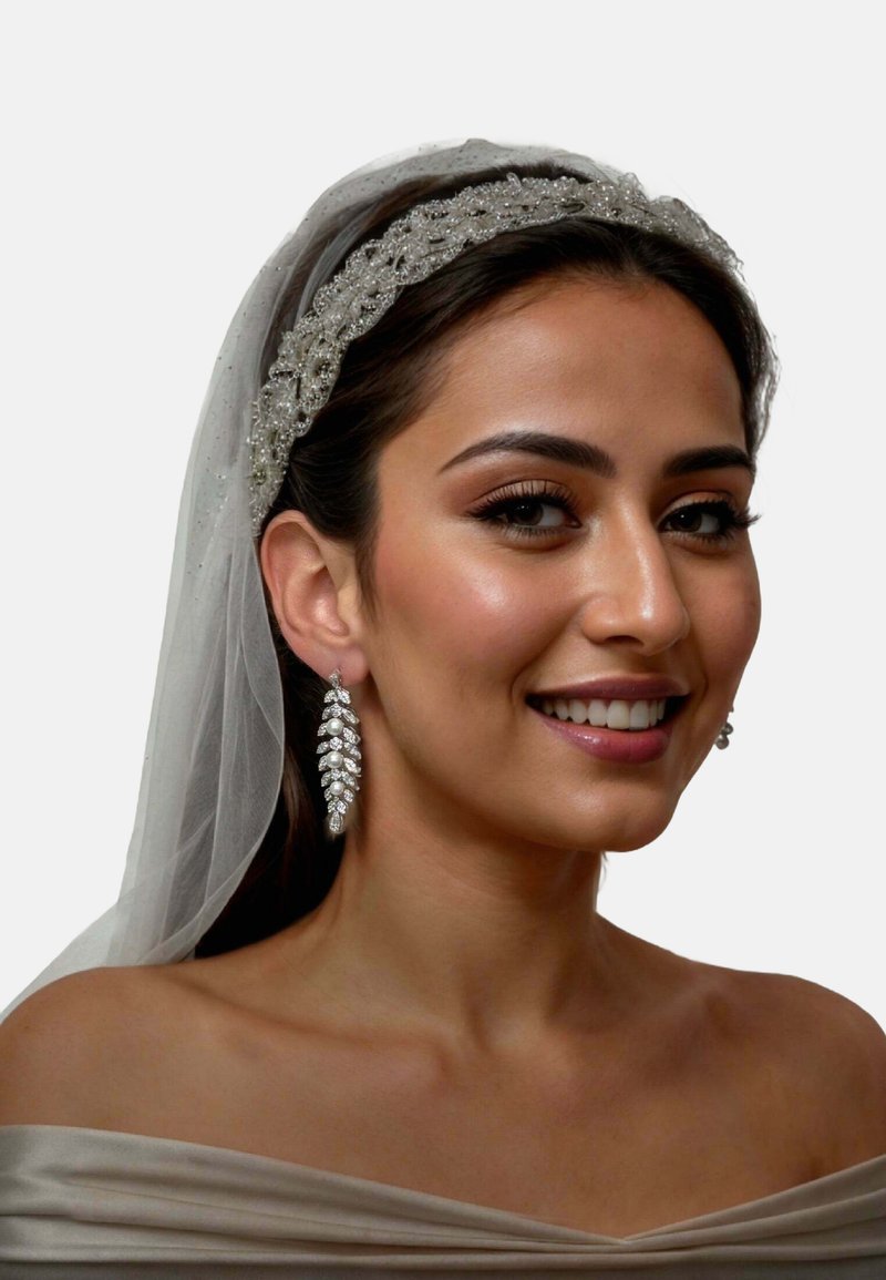 Jewelry set featuring a beaded silver headband and long dangling earrings with a leaf design, shimmering stones, and a soft white veil.