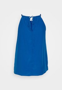 Haut sans manches bleu en halter avec des fines bretelles et une fermeture à nouer au niveau du col, présentant une ouverture en forme de clef à l'avant.