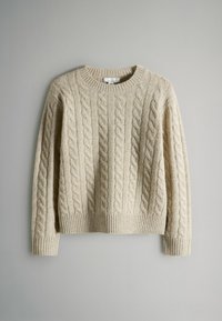 Beige cable-knit sweater with a round neckline and ribbed cuffs and hem. Features textured, raised patterns in a warm, soft fabric.