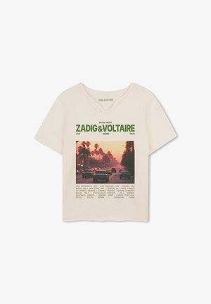 Cream-colored cotton t-shirt featuring a graphic print of a sunset street scene, with green text. Notable round neckline and short sleeves.