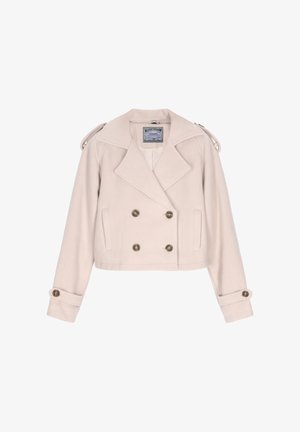 Dubultā krūšu īsā jakas gaismas beisga auduma. Piemīt lielas, apaļas pogas, plašie apkakles, plecu sarga detaļas un ruļļotas piedurknes.