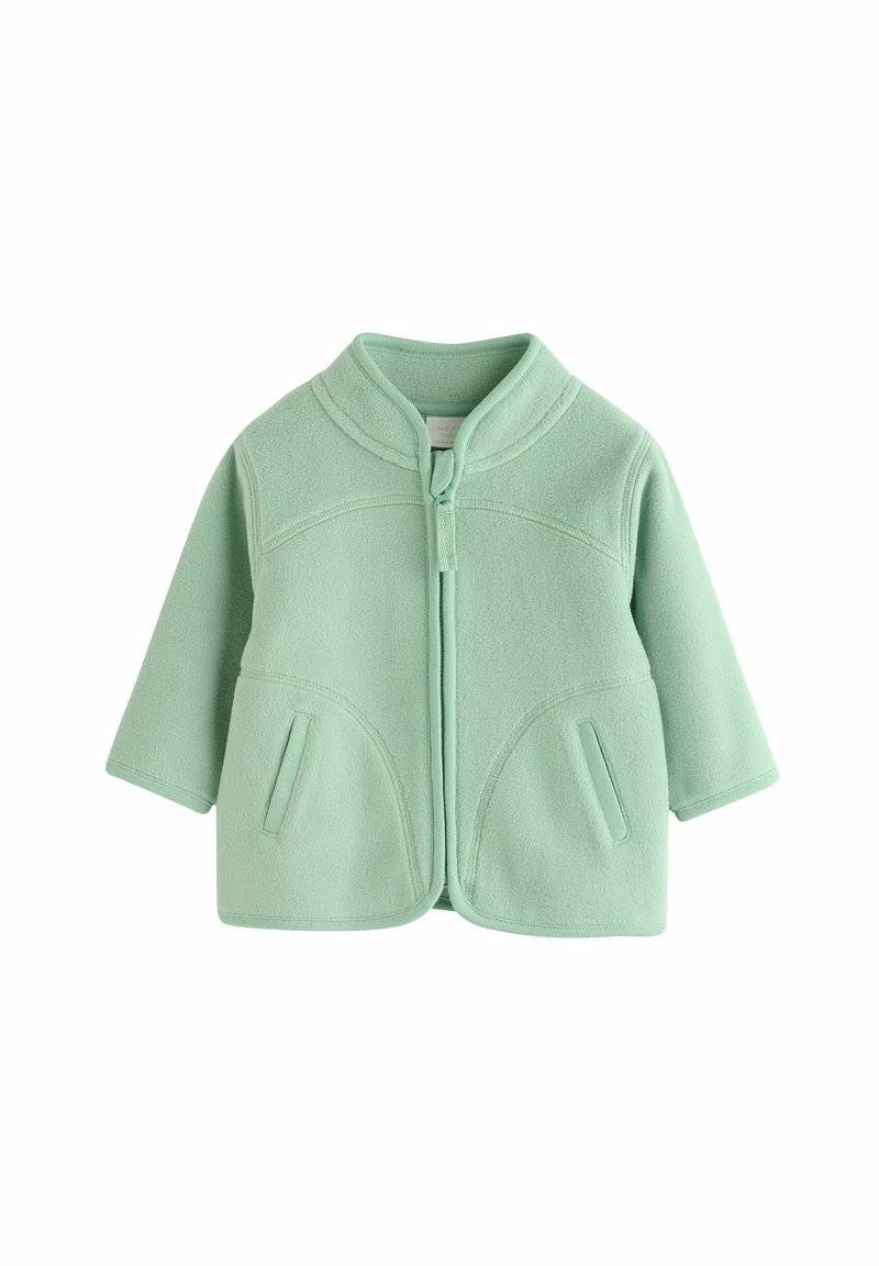 Jachetă din fleece de culoare verde mentă, cu guler înalt, fermoar frontal, două buzunare laterale și o croială lejeră. Textură fină și design fără cusături.
