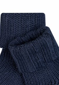 Marineblaue gestrickte Socken mit gerippten Bündchen, die ein strukturiertes Muster und ein weiches Wollmischmaterial aufweisen. Dick und warm für einen angenehmen Tragekomfort.