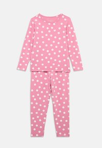 Ροζ πυτζάμα με μακριά μανίκια που έχει λευκές βούλες. Φτιαγμένη από μαλακό βαμβάκι, με στρογγυλή λαιμόκοψη και κολάν σε ταιριαστό σχέδιο.