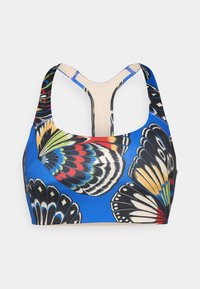 Μπλε αθλητικό σουτιέν με σχέδιο φτερού πεταλούδας σε μαύρο, κόκκινο και πράσινο. Μαλακό ύφασμα με σχέδιο racerback και αντίθεση μπεζ περίγραμμα.