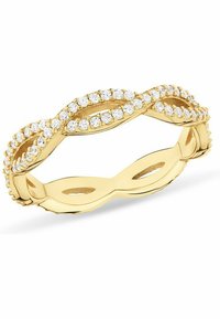 Bague en or avec un design ondulé, ornée de pierres claires sur le dessus. Texture lisse avec des découpes sur les côtés.