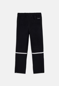 Black athletic pants with elastic waistband, ankle zippers, and reflective white stripes above knees, labeled "AEROREADY" on top right.