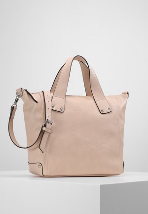 Beige leather tote bag with double handles, detachable shoulder strap, metal buckles, and minimal stitching on white display surface.