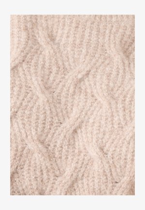 Licht beige gebreide stof met een gestructureerd, golvend patroon. Het materiaal lijkt zacht en pluizig met zichtbare vezels.